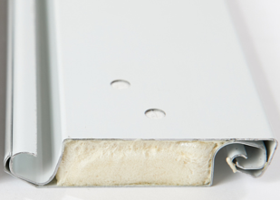 A comparison of polyurethane and polystyrene insulation for rolling doors