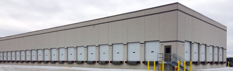 Freight terminal with hundreds of white steel roll-up doors